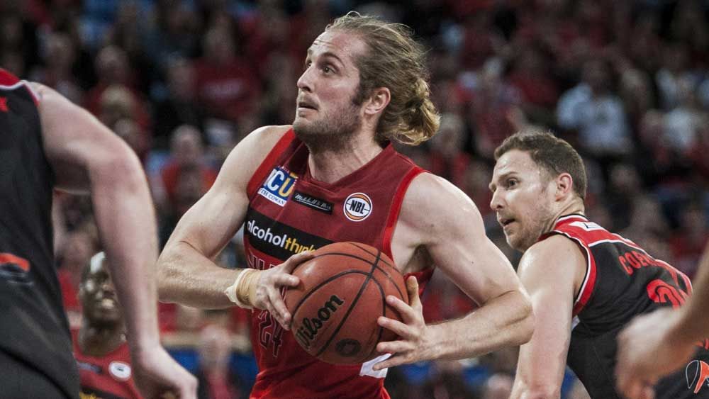 The Perth Wildcats escaped with an 80-73 win over the Hawks. (AAP)