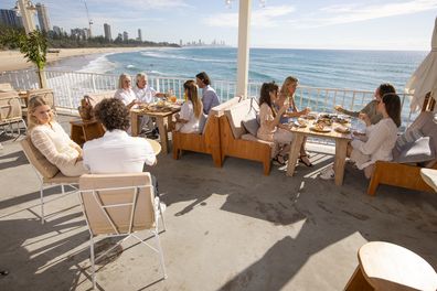 Diners at The Tropic with views over the ocean