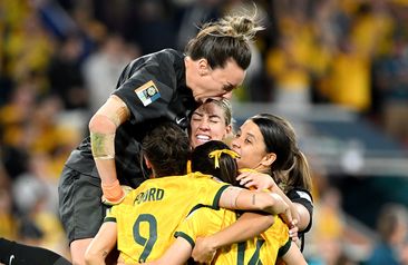BRISBANE, AUSTRALIA - AUGUST 12: Mackenzie Arnold of Australia celebrates with her team mates after Cortnee Vine of Australia scores her team&#x27;s tenth penalty in the penalty shoot out during the FIFA Women&#x27;s World Cup Australia &amp; New Zealand 2023 Quarter Final match between Australia and France at Brisbane Stadium on August 12, 2023 in Brisbane, Australia. (Photo by Bradley Kanaris/Getty Images)