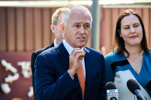 Malcolm Turnbull (centre) speaks to the media during a visit to the Teenie Weenies Learning Centre in Panania today. (AAP)