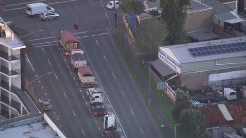 Dozens of trucks have stopped on the Sydney Harbour and Anzac Bridges this afternoon to seek assurances transport workers will be deemed essential.