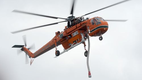 A Victorian water bombing aircraft, similar to this, has crashed into the Thomson Dam on Mount Gregory while battling bushfires.