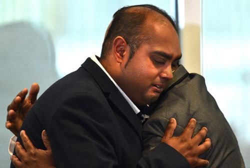 Sameer Sahib, Sanaya's father, and Sheraz Sahib, the child's grandmother, comfort each other at the funeral.