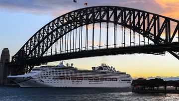 P&amp;O Cruises Australia&#x27;s flagship Pacific Explorer passes under the Harbour Bridge on its first guest cruise following the restart of cruising in Australia on May 31, 2022.