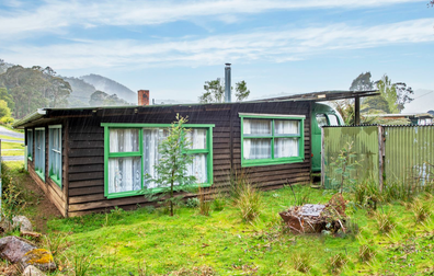 Three bed shack with converted bus in Tasmania on offer for $65,000. 