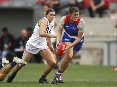 Nell Morris-Dalton of the Bulldogs runs with the ball during the round six AFLW match between the Western Bulldogs and the Fremantle Dockers at Whitten Oval on March 15, 2020. 