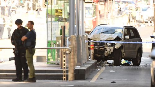 The car remains at the scene as police investigate. (AAP)