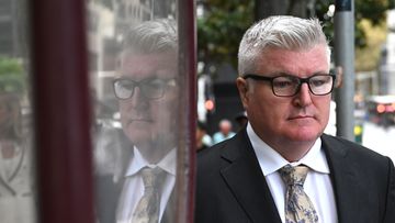 Stuart MacGill leaves the Downing Centre Local Court, in Sydney