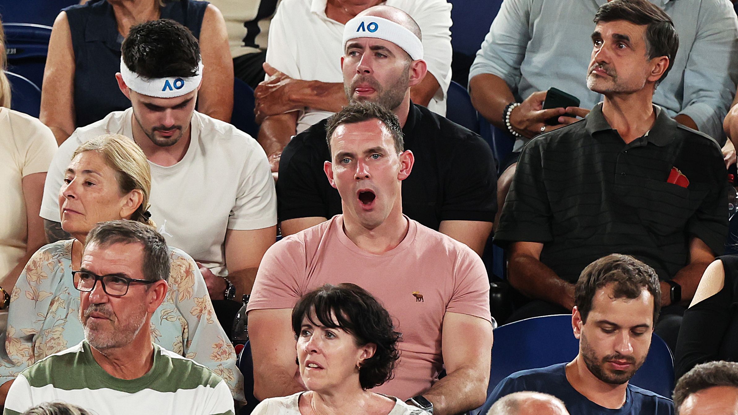 A fan among the crowd yawns mid-way through the quarter-final between Jannik Sinner and Andrey Rublev.