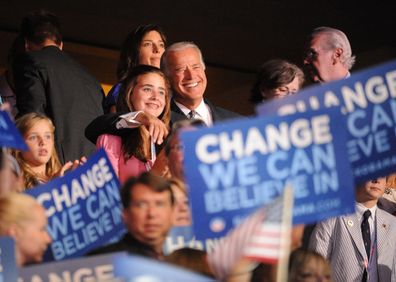 Senator Joe Biden, (D-DE) with his arm around the neck of Naomi, one of his granddaughters. 