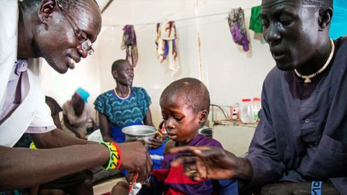 A medical officer from Doctors Without Borders (MSF) attends to a child with malnutrition in a clinic in Old Fangak, Jonglei state, South Sudan. (Image: AFP)