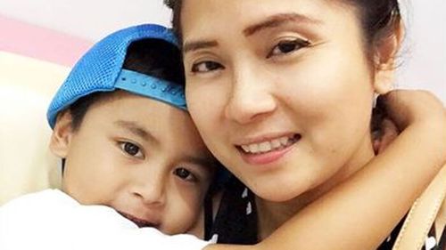 Ms Romulo, with her son Giro.