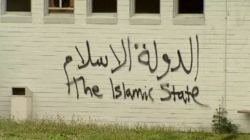 "Islamic State" graffiti was sprayed on to the side of the building. (9NEWS)