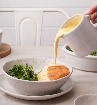 Goat's cheese souffle with creamy lemon cheese sauce