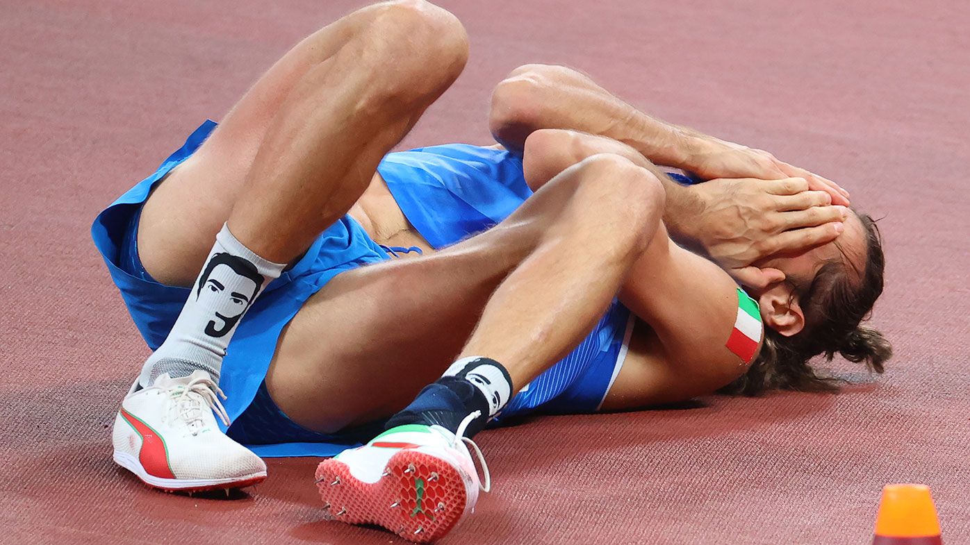 Gianmarco Tamberi of Team Italy celebrates after agreeing to share gold with Mutaz Essa Barshim of Team Qatar in the Men&#x27;s High Jump Final at the Tokyo Olympics.