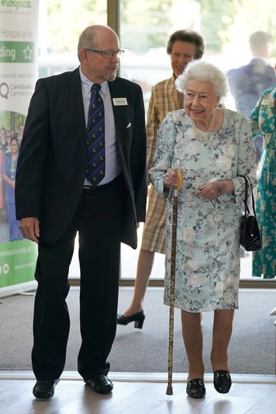 Queen Elizabeth II talks with Jonathan Jones, Chair of Trustees during a visit to officially open the new building at Thames Hospice on July 15, 2022 in Maidenhead, England. 