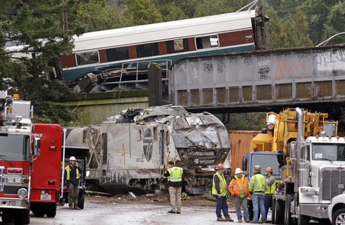 Trucks and cars were tangled in the devastation from the truck crash, (AAP)