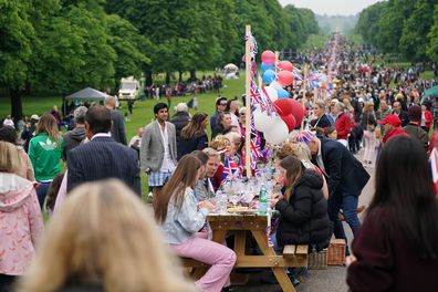 Members of the local community participate in the Big Jubilee Lunch at 'The Long Table' on The Long Walk outside Windsor Castle in Windsor, England, Sunday, June 5, 2022, on day four of the Platinum Jubilee celebrations.