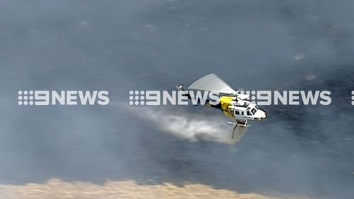 Aircraft are also working to control the bushfire. (9NEWS)