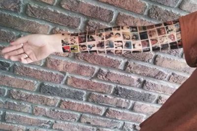 A Dutch woman uploaded a video to YouTube, apparently showing her getting the profile pictures of all 152 of her Facebook friends tattooed onto her arm.<P>The video was later revealed to be as fake as the woman's tattoo, and was said to be a marketing stunt for a company that sold Facebook-themed merchandise.
