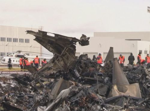  A still image taken from handout video released 18 November 2013 by the Russian Emergency Ministry's press service shows the debris of Boeing 737 passenger airliner at the international airport in Kazan, Russia 18 November 2013. The jet of Tatarstan Airlines flying form Moscow to Kazan crashed in the evening of 17 November on landing, killing all 50 people on board, including 44 passengers and six crew members. EPA/RUSSIAN EMERGENCY MINISTRY PRESS SERVICE HANDOUT