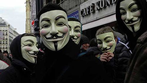 Protestors wear masks of hacker group Anonymous. Source: AAP.