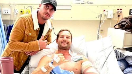 A Perth father who survived a shark attack remains in a stable condition  after undergoing surgery at Royal Perth Hospital.
Doctors were able to save Robbie Peck's arm in a delicate operation.