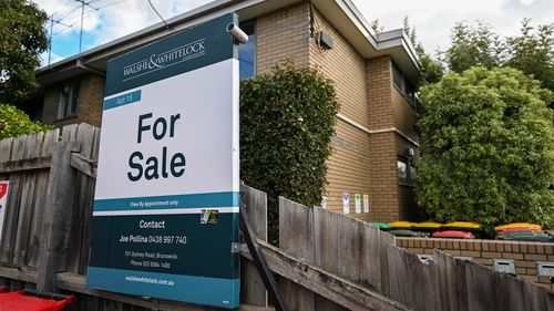 A for sale sign on a home.