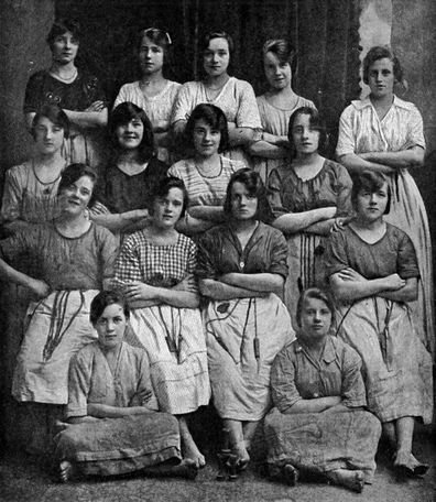 The photo is described as "some happy Ulster girls from a linen factory of North Ireland's chief city."