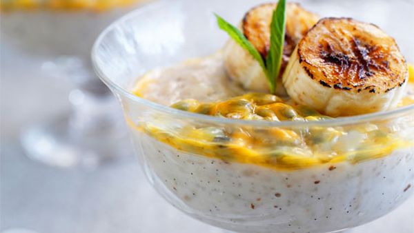 Warm rice pudding with caramelised banana and fresh passionfruit