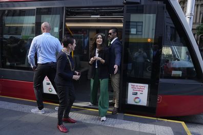 Denmark's Crown Princess Mary steps off a light rail train after a journey with Sydney's Lord Mayor Clover Moore, Friday, April 28, 2023. 