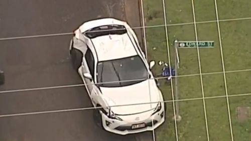 The pair fled Stringybark Street in a white coupe. (9NEWS)