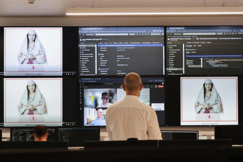Albanian experts work at the National Agency for Information Society as an artificial intelligence "minister" Diella, whose name means "Sun" in Albanian, is seen on the screens in Tirana, Albania.