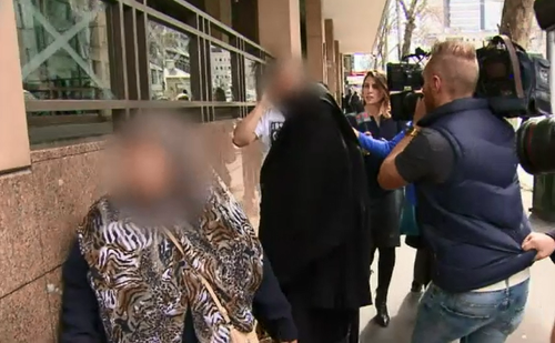 The supporters were scolded by the judge for refusing to following the court rules. (9NEWS)