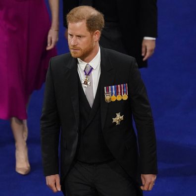 Britain's Prince Harry arrives at Westminster Abbey in a morning suit, with his medals.