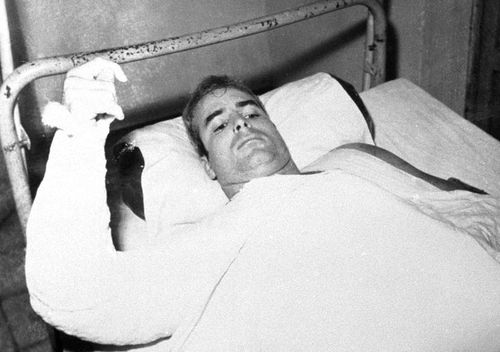 John S. McCain, USN, is shown in this undated photo lying injured in North Vietnam wearing an arm cast. He was a held prisoner during the Vietnam War. (AAP)