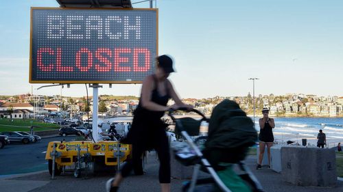 A 'beach closed' sign is seen at Bondi Beach in Sydney.