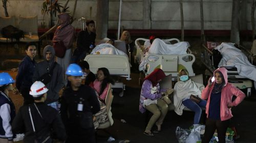 Hospital patients are moved outside of the hospital building after an earthquake was felt in Denpasar, Bali, 