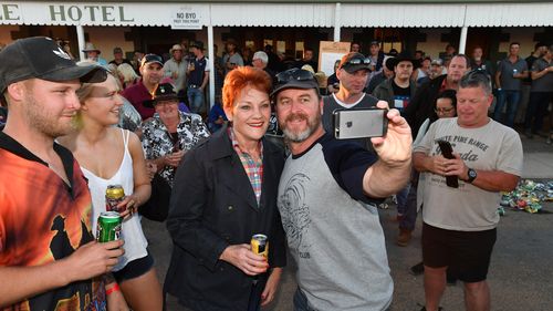 One Nation leader, Senator Pauline Hanson poses for selfies outside the Birdsville Hotel in Birdsville. (AAP)