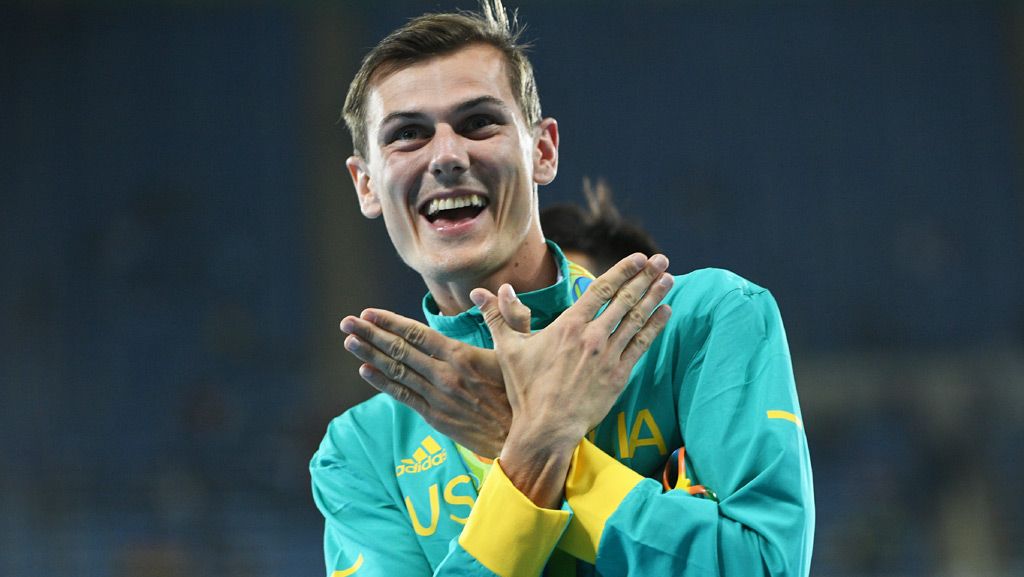 Bronze medallist Australia's Dane Bird-Smith celebrates on the podium for the Men's 20km Race Walk at the Rio 2016 Olympic Games at the Olympic Stadium in Rio de Janeiro on August 12, 2016. (AFP)
