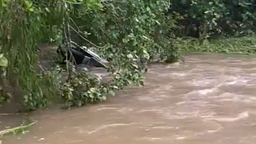 A woman has been found dead in a submerged vehicle North of Mackay.