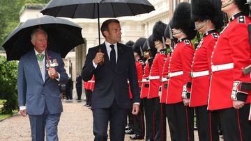 Prince Charles, Prince of Wales and Camilla, Duchess of Cornwall greet French President Emmanuel Macron with a namaste gesture as he arrives at Clarence House on June 18, 2020 in London, England