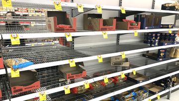 Supermarket shelves emptied of pasta and spaghetti.