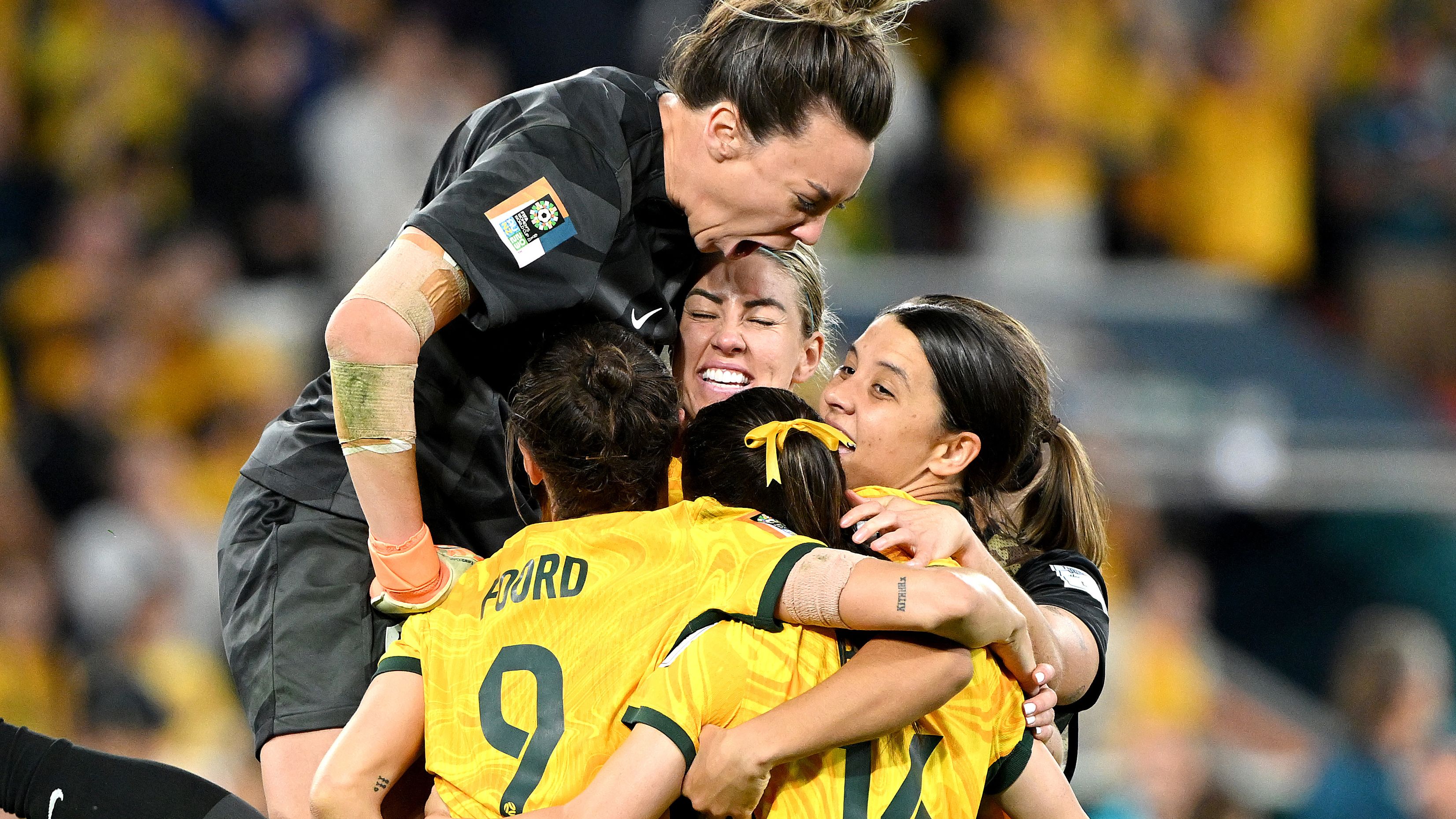 BRISBANE, AUSTRALIA - AUGUST 12: Mackenzie Arnold of Australia celebrates with her team mates after Cortnee Vine of Australia scores her team&#x27;s tenth penalty in the penalty shoot out during the FIFA Women&#x27;s World Cup Australia &amp; New Zealand 2023 Quarter Final match between Australia and France at Brisbane Stadium on August 12, 2023 in Brisbane, Australia. (Photo by Bradley Kanaris/Getty Images)