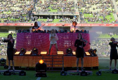 Peking Duck performed for the crowd before the start of the match.