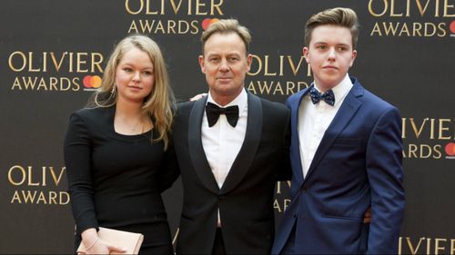 Jason Donovan has posed with his children Jemma, 18, and Zac, 17, on the Olivier Awards red carpet. (AAP)