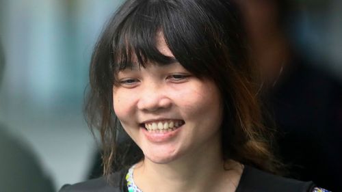 Vietnamese Doan Thi Huong, left, is escorted by police as she leaves after the court hearing at the Shah Alam court house in Shah Alam court house in Shah Alam, outside Kuala Lumpur. (AP)