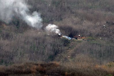 Debris from a Sikorsky S-76 helicopter belonging to former Los Angeles Lakers Kobe Bryant lays in the hills after crashing in Calabasas, California