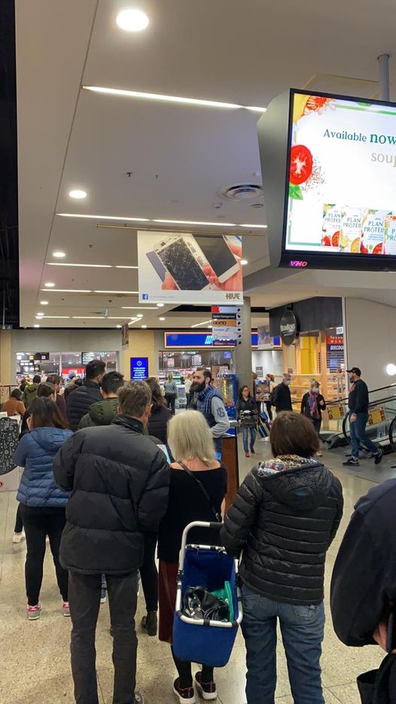 Queues outside an Aldi store in Melbourne ahead of their cookware Special Buys sale in May 2020