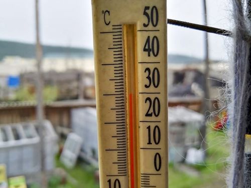 An outdoor thermometer indicating 30 Celsius (86 Fahrenheit) around 11pm in Verkhoyansk, Sakha Republic, about 4,660 kilometers (2,900 miles) northeast of Moscow, Russia in June, 2020. 